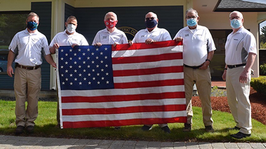 The MELD Team photo with the American Flag